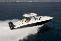 sport-fishing boat : outboard center console boat (twin engine, stepped hull, cabin, T-Top) 34 PIED A MER Midnight Express