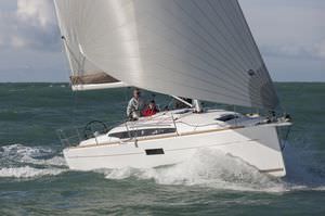 cruising sailboat / open transom / with 2 or 3 cabins / twin steering wheels