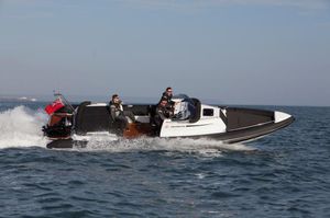 inboard inflatable boat / rigid / center console / with cabin