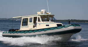 outboard inflatable boat / twin-engine / RHIB / with enclosed cockpit