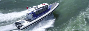 outboard patrol boat / aluminum / semi-rigid / with enclosed cockpit