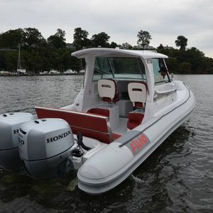twin-engine inflatable boat / with enclosed cockpit / recreational / semi-rigid