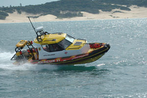 outboard search and rescue boat / inflatable boat / with enclosed cockpit