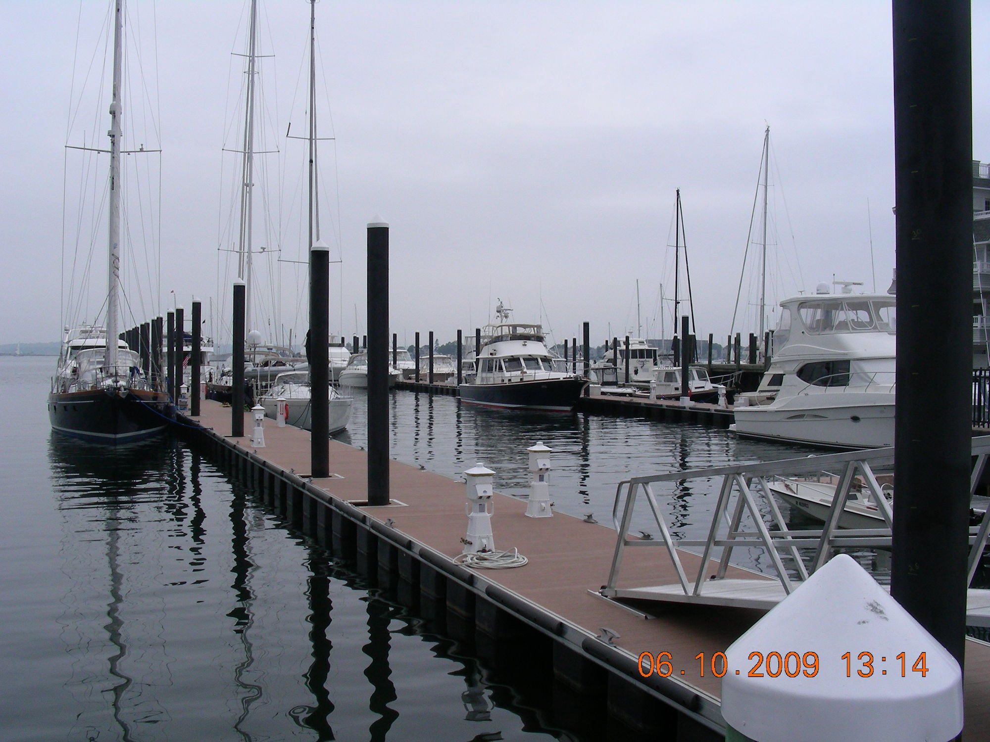 Dock anchoring system Flexible, vertical track beams, aarms, piles, etc. Structurmarine