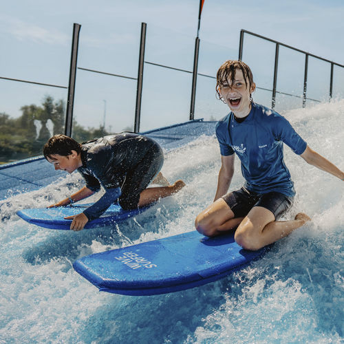 a child and an adult bodyboard - WAVESURFER