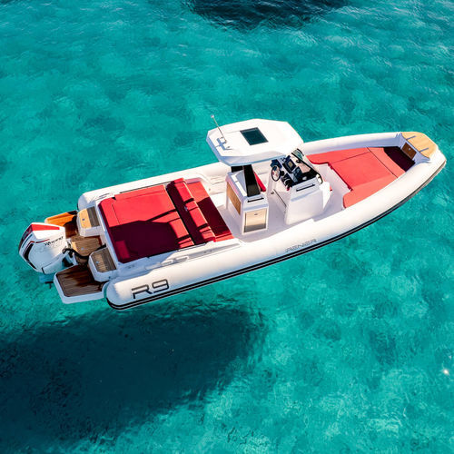Outboard inflatable boat - R9 FB - RENIER - rigid / center console / 14-person max.