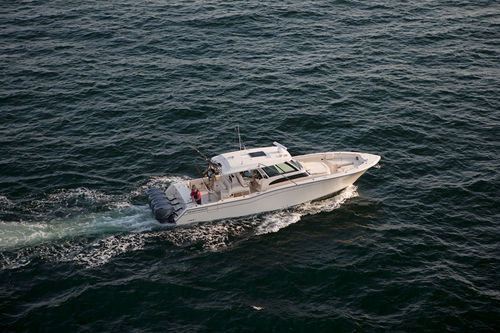 Outboard express cruiser - Canyon 456 - Grady-White - four-engine / with enclosed cockpit / center console