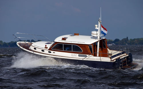 Inboard express cruiser - RIFFLER 39 - Neil Marine (Pvt) Ltd - twin-engine / hard-top / fiberglass