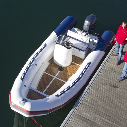 Outboard inflatable boat - DR-560 - Vanguard International - rigid / open / side console