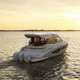 outboard express cruiser / triple-engine / flybridge / with cabin