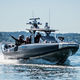 patrol boat / outboard / aluminum / rigid hull inflatable boat