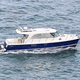 catamaran express cruiser / outboard / twin-engine / hard-top